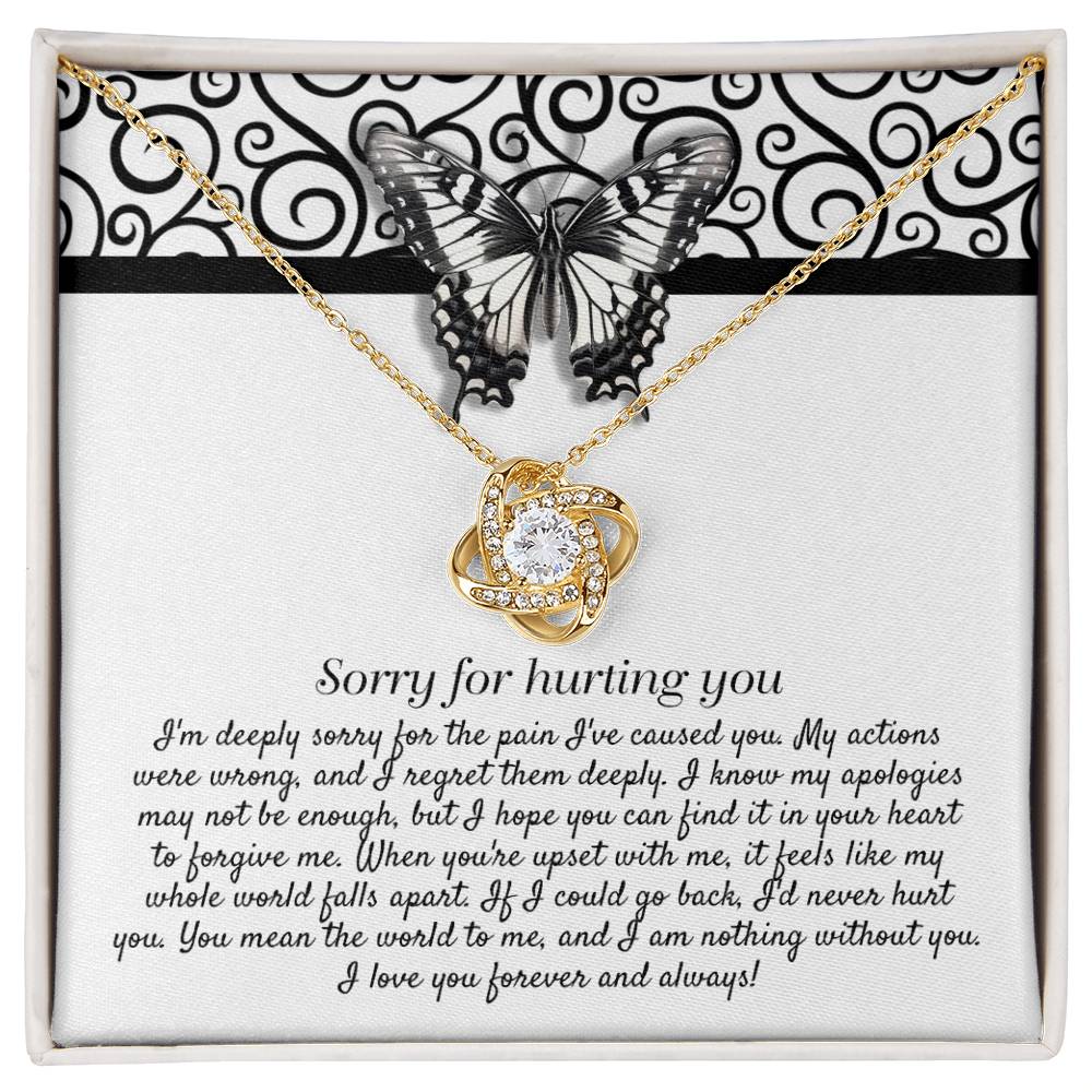 The "Sorry-Nothing Without You - Love Knot Necklace" features a heart-shaped pendant adorned with cubic zirconia crystals and is presented on a card with an apology message and a butterfly design.