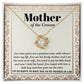 A "To Mother-In-Law, To Have You - Love Knot Necklace" with a heart-shaped pendant adorned with cubic zirconia crystals on a card labeled "Mother of the Groom" with a loving message expressing gratitude from the groom.