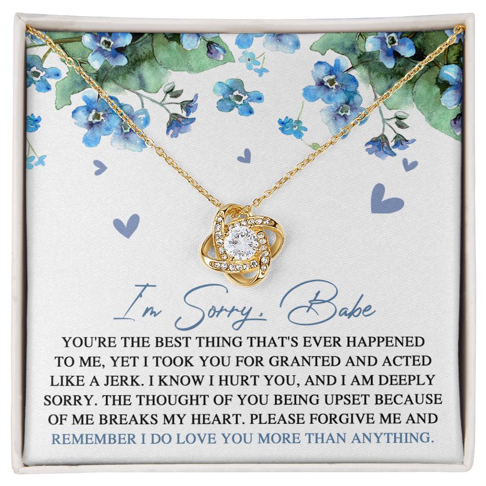 Introducing the "Sorry-More Than Anything - Love Knot Necklace," featuring a cubic zirconia pendant set against a floral background. This heartfelt personalized gift comes with a note that reads, "I'm Sorry, Babe. You're the best thing that's ever happened to me... Please forgive me and remember I do love you more than anything.