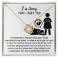 A gold Love Knot necklace adorned with Cubic Zirconia Crystals is displayed in a box. The box reads "I'm Sorry-Stop Talking THAT I HURT YOU," followed by a heartfelt message apologizing for causing pain and expressing a desire to make amends.