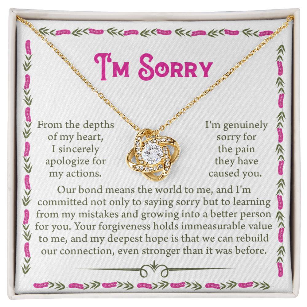 The Sorry-A Better Person - Love Knot Necklace in gold features a heart-shaped pendant, presented in an elegant jewelry box adorned with cubic zirconia crystals. Inside the box is a heartfelt message expressing sincere apologies and commitment to learning and strengthening the bond.