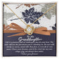 The Granddaughter-Have Mine - Love Knot Necklace, featuring a heart design, is beautifully placed over a card with a heartfelt message to a granddaughter and is elegantly presented in a decorative box. The necklace is crafted from white gold and adorned with sparkling cubic zirconia for added brilliance.
