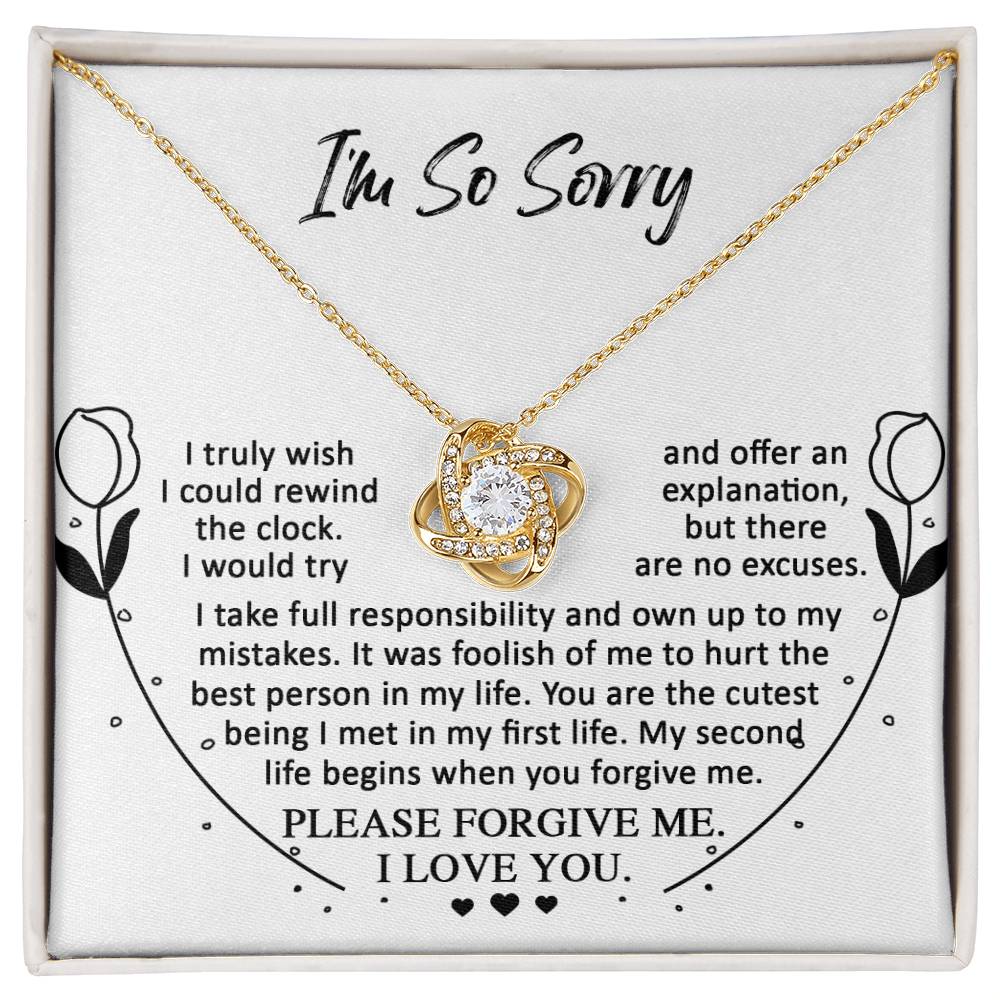 A stunning white gold "Sorry-My First Life - Love Knot Necklace" adorns a white card that reads, "I'm So Sorry," accompanied by a heartfelt apology message and a plea for forgiveness. The elegance of the cubic zirconia adds an extra touch of sincerity to your apology.