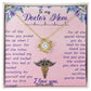 A gold-colored To My Doctor Mom, For All The Times You Picked Me Up - Love Knot Necklace with a heart-shaped pendant, adorned with cubic zirconia crystals and a medical caduceus symbol, presented on a pink card with a heartfelt message to a mother who by ShineOn Fulfillment.