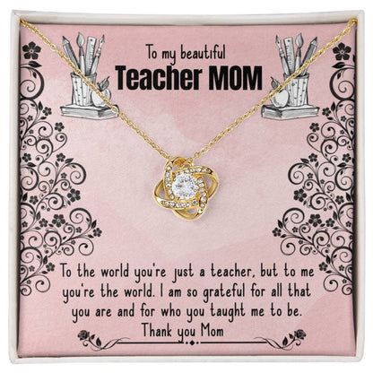 A necklace gift box with a sentimental message for a mother who is also a teacher, featuring an 18k yellow gold To My Beautiful Teacher MOM, To The World You're Just A Teacher - Love Knot Necklace with a heart design by ShineOn Fulfillment.