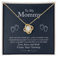 To My Mommy, Love From Your Tummy - Love Knot Necklace by ShineOn FulfillmentępGold heart-shaped pendant with cubic zirconia crystals and baby footprints on a display card with a sentimental message for an expectant mother.