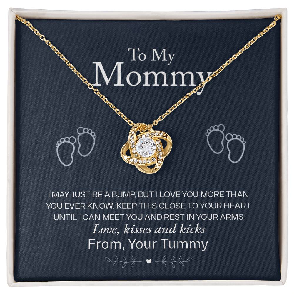 To My Mommy, Love From Your Tummy - Love Knot Necklace by ShineOn FulfillmentępGold heart-shaped pendant with cubic zirconia crystals and baby footprints on a display card with a sentimental message for an expectant mother.