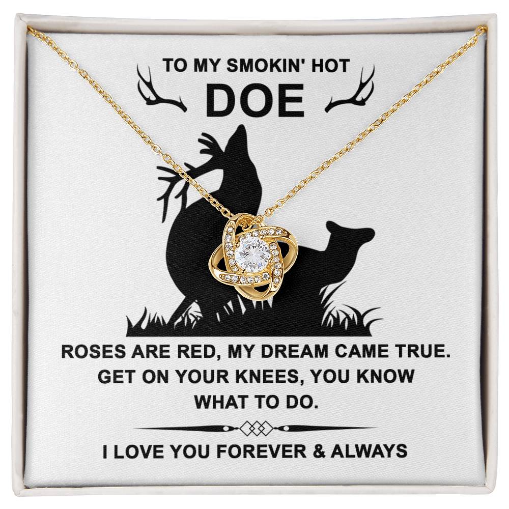 The Soulmate-Dream Came True - Love Knot Necklace, enhanced with cubic zirconia crystals and a white gold finish, gracefully rests on a card reading "To my smokin' hot doe" with a romantic poem and deer silhouettes.