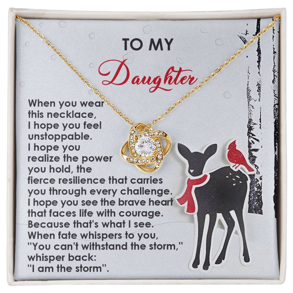 The Daughter-Every Challenge - Love Knot Necklace, embellished with Cubic Zirconia Crystals, is elegantly presented in a gift box labeled "To My Daughter" and includes a motivational message alongside an illustration of a deer and cardinal, symbolizing an unbreakable bond.