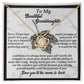 This personalized gift showcases the Granddaughter-Deeply Loved - Love Knot Necklace with a heart and cubic zirconia centerpiece, elegantly displayed in a gift box featuring a sentimental message for your granddaughter.