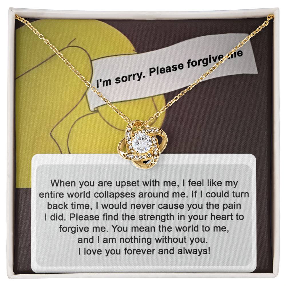 A "Sorry, Nothing Without You" Love Knot Necklace adorned with cubic zirconia crystals is elegantly placed over a card that reads, "When you are upset with me..." and continues with a heartfelt apology and expression of love.