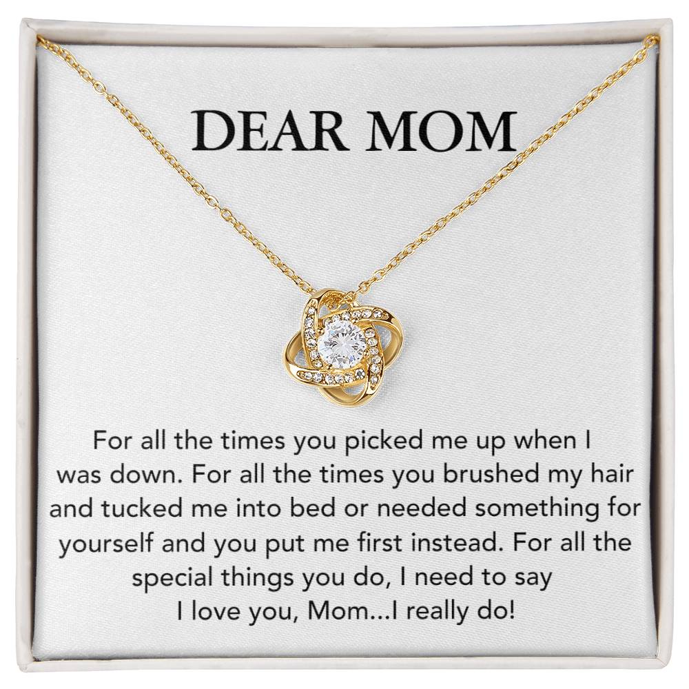 A Dear Mom, For All The Times You Picked Me Up Love Knot Necklace with cubic zirconia crystals, displayed on a card with a heartfelt message to mom, expressing gratitude and love from ShineOn Fulfillment.