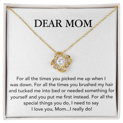A Dear Mom, For All The Times You Picked Me Up Love Knot Necklace with cubic zirconia crystals, displayed on a card with a heartfelt message to mom, expressing gratitude and love from ShineOn Fulfillment.