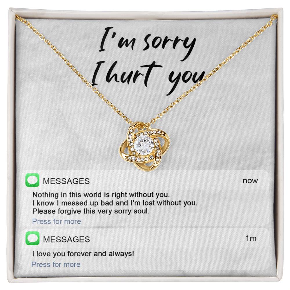 Image of the Sorry-Lost Without You - Love Knot Necklace with a diamond pendant against a background with the text "I'm sorry I hurt you." Below are text messages reading "Nothing in this world is right without you... Please forgive this very sorry soul." and "I love you forever and always!