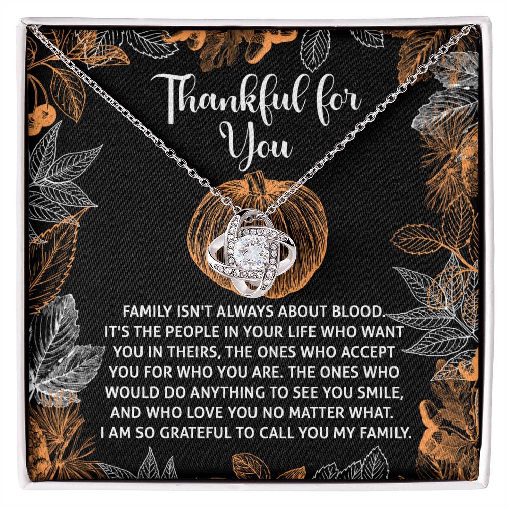 The Thanksgiving-To Call You - Love Knot Necklace comes with a pendant on a decorative card that reads "Thankful for You." It features an inspiring message about the significance of chosen family and love. The necklace shines with a white gold finish and is adorned with sparkling cubic zirconia, beautifully capturing your heartfelt sentiments.