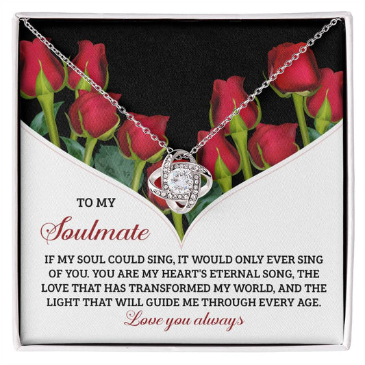 The Soulmate-Eternal Song - Love Knot Necklace comes in a gift box adorned with red roses and features a romantic soulmate message. Enhanced with cubic zirconia, its interlocking knot pendant makes it a stunning personalized gift for your special someone.