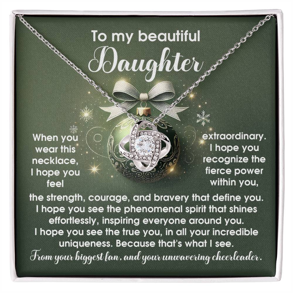 The Daughter-Incredible Uniqueness - Love Knot Necklace, adorned with a decorative pendant accented by cubic zirconia crystals, is beautifully presented in a gift box that showcases an inspirational message to a daughter.