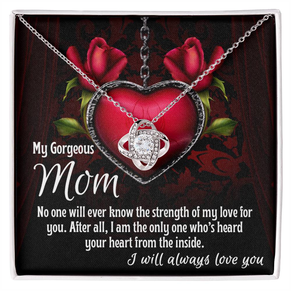 A [Almost Sold Out] To Mom, Heard Your Heart - Love Knot Necklace with an infinity heart pendant is placed against a red heart and roses background. The text reads: "My Gorgeous Mom. No one will ever know the strength of my love for you. I will always love you." Adorned with cubic zirconia crystals, it makes the perfect personalized gift.