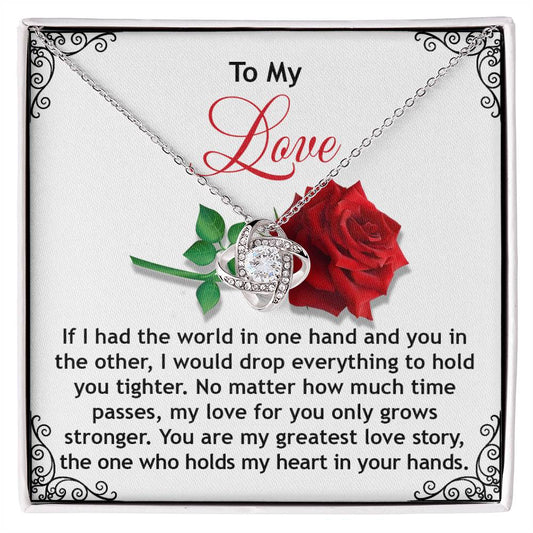 The Soulmate-In Your Hands - Love Knot Necklace gift box features "To My Love," a red rose, and a heart-shaped pendant with cubic zirconia crystals, complemented by a romantic message of unwavering affection, ideal for personalized gifts for cherished ones.