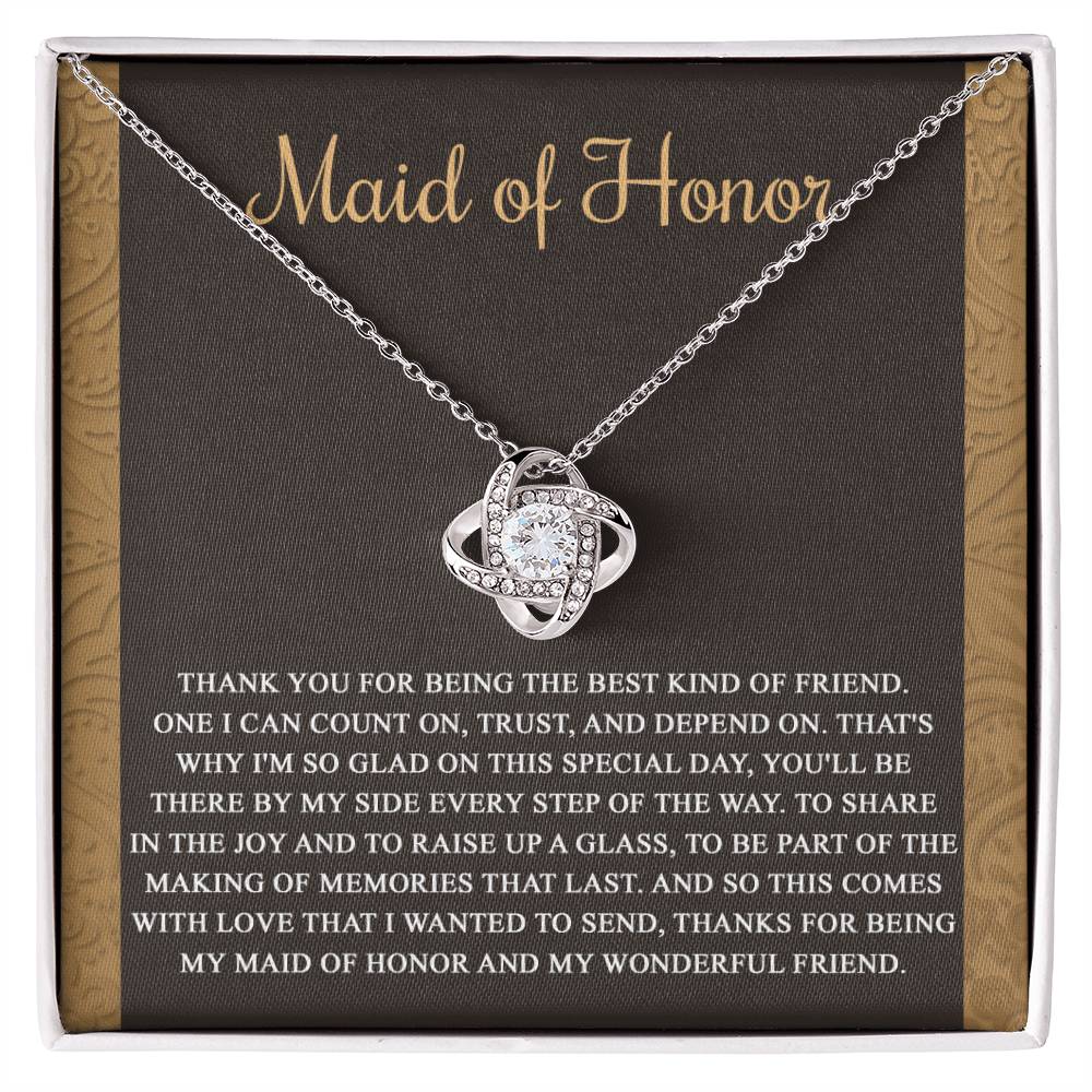 The "To Maid of Honor, Kind Of Friend - Love Knot Necklace" features an intertwined knot design adorned with cubic zirconia crystals on a background that reads "Maid of Honor," followed by a heartfelt thank you message to the maid of honor.