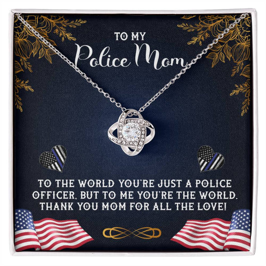 A graphic image depicting a gift, likely a card or poster, dedicated to a "police mom" with a heart-shaped To My Police Mom, To The World You're Just A Police Officer - Love Knot Necklace from ShineOn Fulfillment and decorative elements including leaves, American flag motifs, and heartfelt messages.