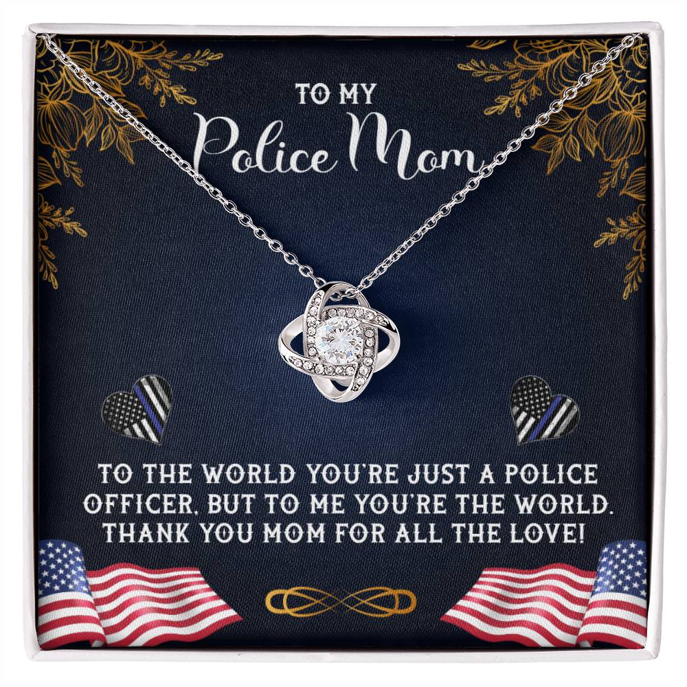 A graphic image depicting a gift, likely a card or poster, dedicated to a "police mom" with a heart-shaped To My Police Mom, To The World You're Just A Police Officer - Love Knot Necklace from ShineOn Fulfillment and decorative elements including leaves, American flag motifs, and heartfelt messages.
