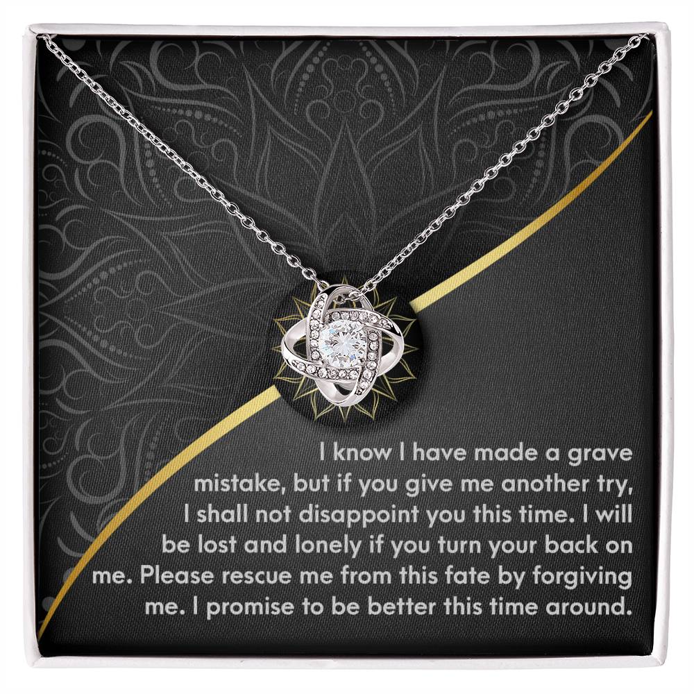 The Sorry-Turn Your Back - Love Knot Necklace, crafted from 14k white gold and adorned with premium cubic zirconia crystals, is elegantly displayed in a box. Inside, a heartfelt message expresses remorse and a sincere plea for forgiveness.