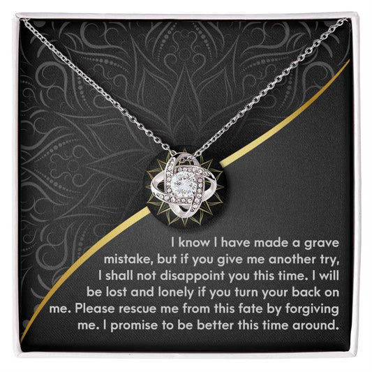 The Sorry-Turn Your Back - Love Knot Necklace, crafted from 14k white gold and adorned with premium cubic zirconia crystals, is elegantly displayed in a box. Inside, a heartfelt message expresses remorse and a sincere plea for forgiveness.