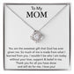 A "To My Mom, You Are The Sweetest Gift That God Has Ever Given Me" love knot necklace with a heart-shaped pendant encrusted with cubic zirconia crystals is displayed in a box, accompanied by a message to a mother expressing gratitude and love from ShineOn Fulfillment.