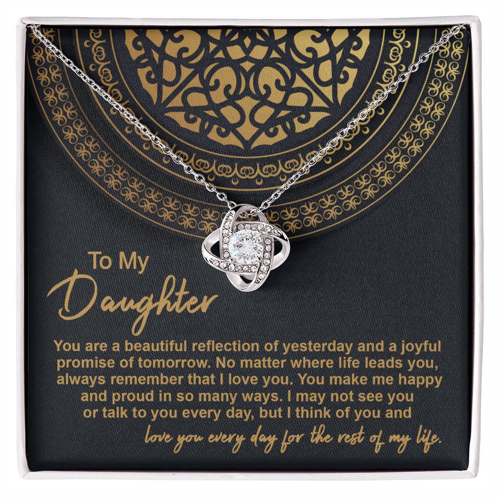 The "To Daughter, Beautiful Reflection 2 - Love Knot Necklace" in 14k white gold is elegantly presented in a black gift box adorned with gold patterns. The box carries the inscription "To My Daughter" along with a heartfelt message expressing love and pride.