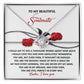The Soulmate-Every Morning Love Knot Necklace features a rose design with cubic zirconia crystals. It comes in an elegant box and includes the message: "To my beautiful soulmate," ending with "Babe, I love you." A truly personalized gift for that special someone.