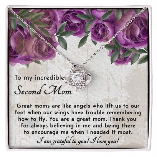 To Bonus Mom, Grateful For You - Love Knot Necklace laying over a note with a heartfelt message for a "second mom," surrounded by floral designs.