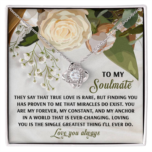 The Soulmate-Greatest Thing - Love Knot Necklace, featuring dazzling cubic zirconia crystals, is beautifully presented on a floral card with a heartfelt message for your soulmate, making it an ideal personalized gift.
