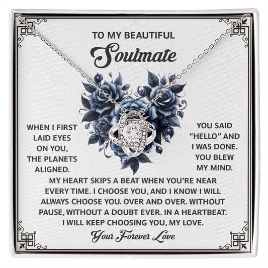 The Soulmate-Skips A Beat - Love Knot Necklace features cubic zirconia crystals intertwined elegantly on a card with a heartfelt message for a "beautiful soulmate," expressing love and devotion, making it the perfect personalized gift.
