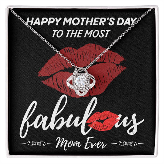 A Mother's Day gift box featuring a "To Mom, The Most Fabulous" love knot necklace with a gold finish pendant, placed on a card with red lips and the words "Happy Mother's Day to the most fabulous mom ever.