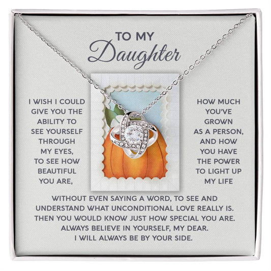 The Daughter-How Special - Love Knot Necklace comes in a gift box and features a stunning cubic zirconia centerpiece with an intertwined heart design. The accompanying card delivers heartfelt messages from a parent to their daughter, making it an exceptionally personalized gift.