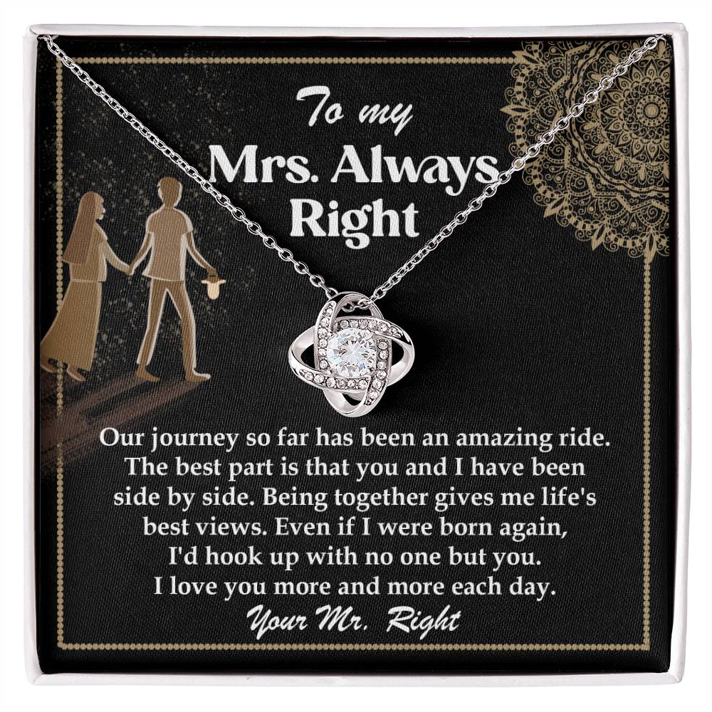 A silver To Wife, Always Right - Love Knot Necklace with an intertwined design, adorned with cubic zirconia crystals, placed on a card that reads: "To my Mrs. Always Right" with a romantic message about love and appreciation.