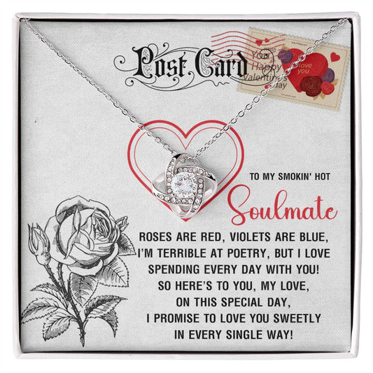 The Soulmate-Special Day - Love Knot Necklace features a silver heart necklace entwined like a love knot, with shimmering cubic zirconia crystals in either white or yellow gold. It comes in a box with a rose illustration and Valentine message about love and poetry for your soulmate.