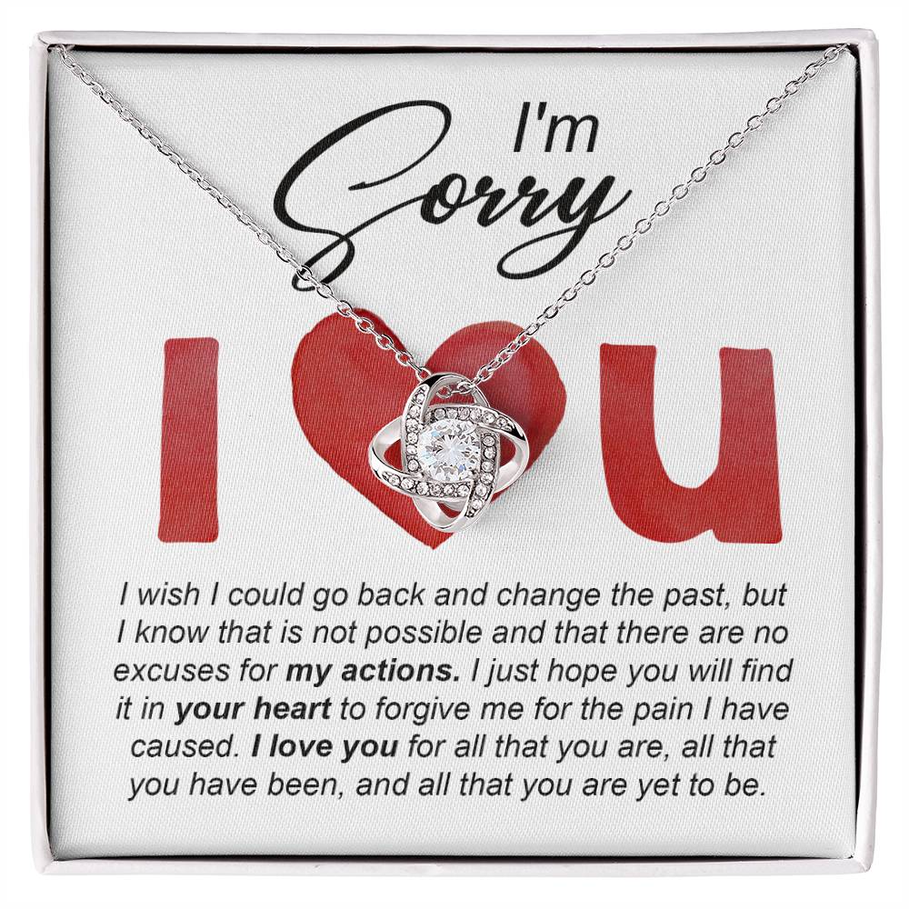 The Sorry-Change The Past - Love Knot Necklace comes with an apology message that reads, "I'm sorry. I wish I could go back and change the past... I love you for all that you are, all that you have been, and all that you're yet to be." This beautiful necklace is available in either a white gold or yellow gold finish, adorned with sparkling cubic zirconia crystals.