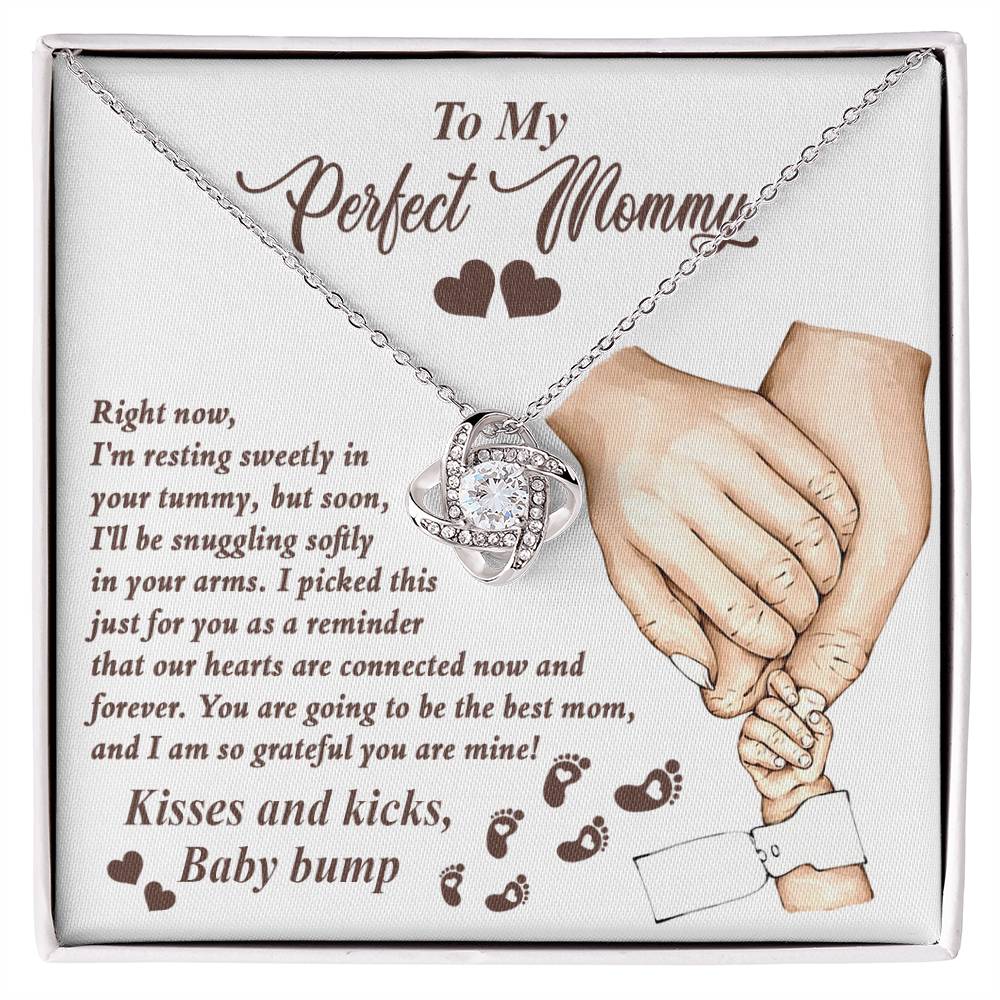 A personalized gift box with a To Mama To Be, Now And Forever - Love Knot Necklace from ShineOn Fulfillment, featuring cubic zirconia, and a heartfelt printed message from an unborn baby to its mother.
