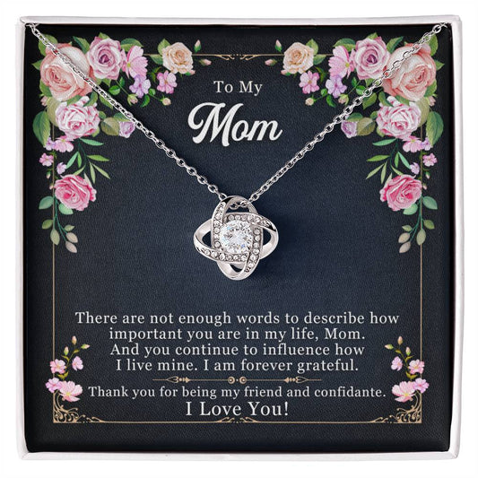 A "To My Mom, Thank yOU For Being My Friend" Love Knot Necklace with a heart-shaped pendant and a message for mom, presented in a floral gift box by ShineOn Fulfillment.
