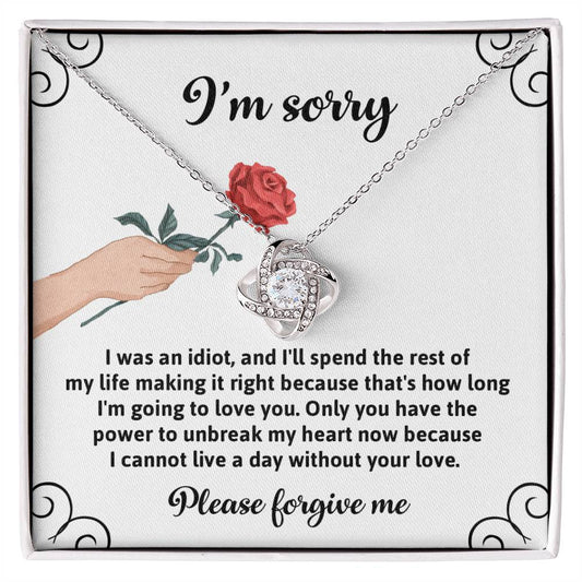 Presenting the "Sorry, Making It Right - Love Knot Necklace," a heartfelt expression of regret and love. This exquisite piece features an illustration of a hand holding a rose and comes with an apology message that conveys deep remorse and a devotion to making amends. Crafted from white gold, this necklace is adorned with sparkling cubic zirconia to add elegance and brilliance.