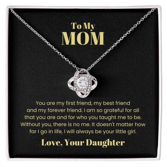 To My Mom, You Are My First Friend love knot necklace in a black gift box with a heartfelt message from a daughter to her mother inscribed on the box lid.