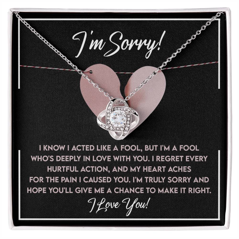 The "Sorry-Deeply In Love - Love Knot Necklace" features a cubic zirconia pendant on a card that says "I'm Sorry!" along with a heartfelt message expressing regret and love.