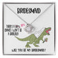 A bridesmaid proposal necklace box featuring a dinosaur with a veil and a stunning To Bridesmaid, Will You Be - Love Knot Necklace in white gold. The text reads, "There's a 90% chance I won't be a bridezilla. Will you be my bridesmaid?