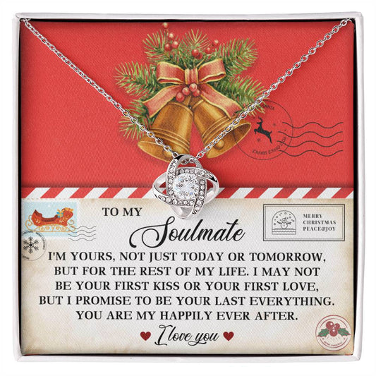 The Soulmate-Happily Ever After - Love Knot Necklace, embellished with sparkling cubic zirconia, is gracefully displayed on a card featuring a romantic message, holiday bells, and greenery. It's the perfect personalized gift to express your love this season.