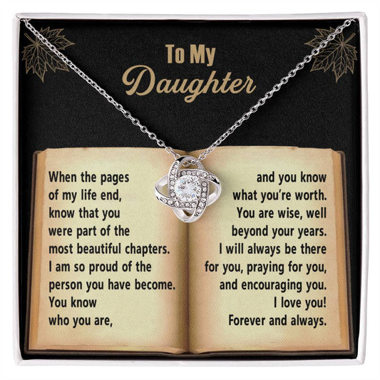 Daughter-Beyond Your Years - Love Knot Necklace adorned with cubic zirconia crystals, displayed on a black velvet background. Text reads: "To My Daughter" with a heartfelt message in an open-book design, making it the perfect gift for your loved one.