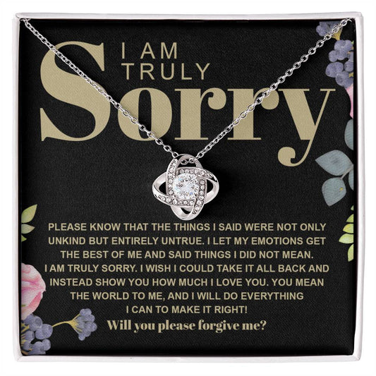 The Sorry-Best Of Me - Love Knot Necklace, featuring a heart-shaped cubic zirconia crystal pendant, is elegantly presented on a card with an apology message expressing deep regret and a sincere plea for forgiveness.