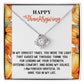 The Thanksgiving-Guided Me Through - Love Knot Necklace, featuring a heart-shaped pendant adorned with sparkling cubic zirconia crystals, rests gracefully on a Thanksgiving-themed card, beautifully capturing the timeless gratitude of an unbreakable bond.
