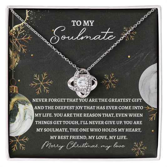 Soulmate-Greatest Gift Love Knot Necklace, featuring a heart-shaped pendant adorned with cubic zirconia crystals and finished in white gold, presented in a Christmas-themed box with a heartfelt message for your soulmate.